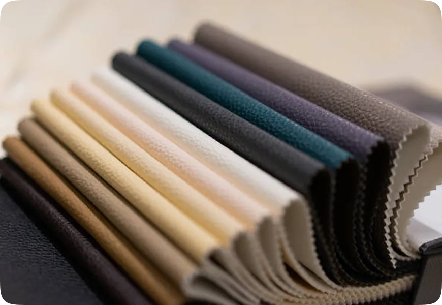 A bunch of different colors of leather on a table.
